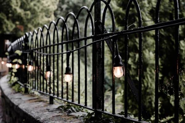 Fence with lights along a path