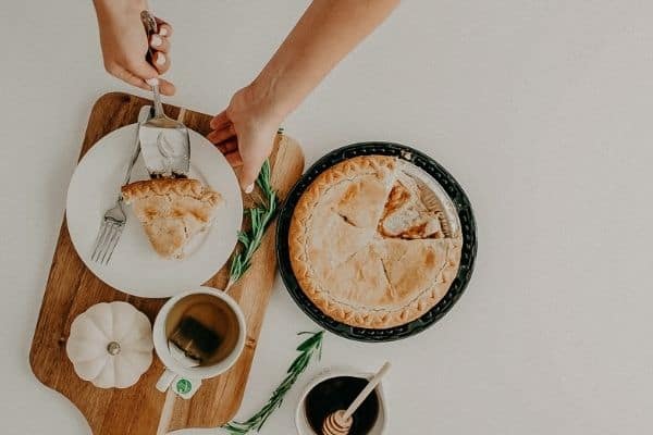 woman cutting pie
