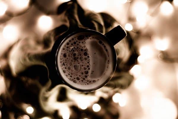 Cup of cocoa and warm lights ready to make warm memories 